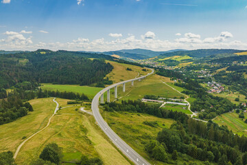 Road and bridge in green mountains. Silesian Beskids, Poland.