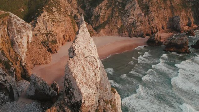 Aerial Drone footage of Praia da Ursa in Portugal during Sunset