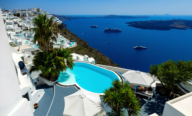 Obraz premium Santorini, Greece. Amazing view of blue sky, sea and pool from luxury resort in Santorini greek island.