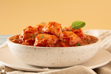 Delicious Gnocchi with Red Sauce and Basil served in a White textured Handmade Ceramic Bowl