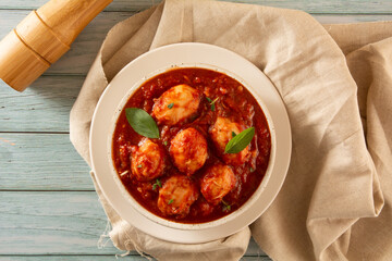 Delicious Gnocchi with Red Sauce and Basil served in a White textured Handmade Ceramic Bowl