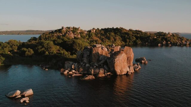 Aerial footage during sunset at Lake Victoria, Mwanza, City of Rocks, Tanzania