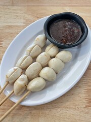 Fried and grilled Meat Balls on sticks, Thai street food market