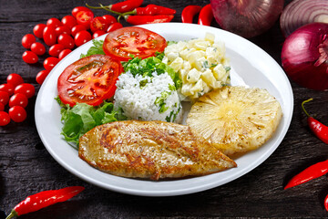 Grilled pork with fries and vegetables