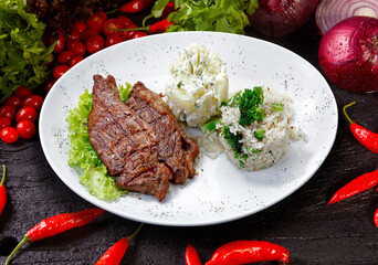 Beef steak with potatoes and rice
