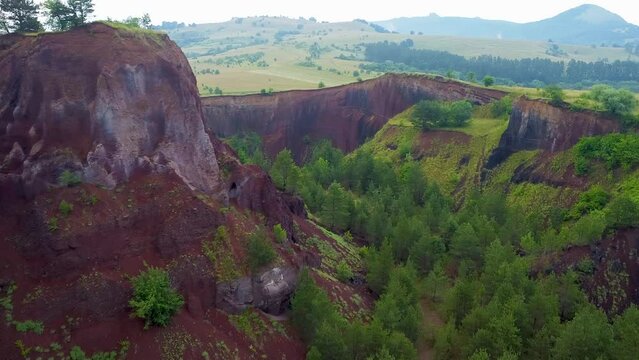 4K Aerial Drone flyover footage of the extinct Racos Volcano. Dormant Volcano with lush vegetation in summer.