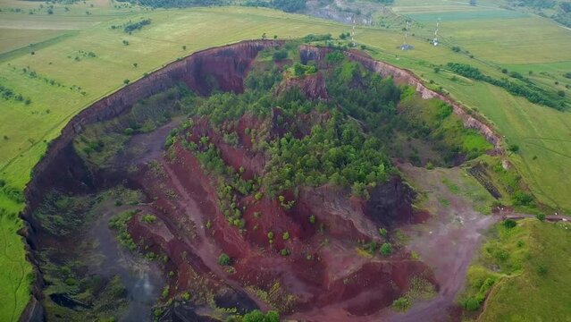 4K Aerial Drone flyover footage of the extinct Racos Volcano. Dormant Volcano with lush vegetation in summer.