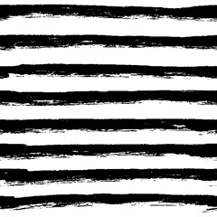 Decorative seamless pattern with handdrawn rough lines in stripes. Hand painted grungy ink doodles in black and white colors. Trendy endless texture for digital paper, fabric, backdrops, wrapping