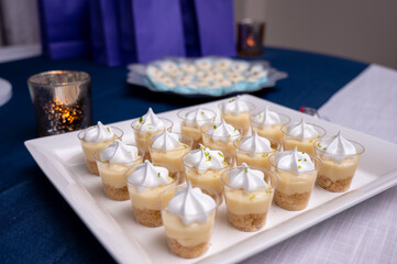 Mini lemon meringue tarts filled with lemon curd, one bite desserts