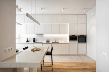 Minimalistic and new kitchen with white facade