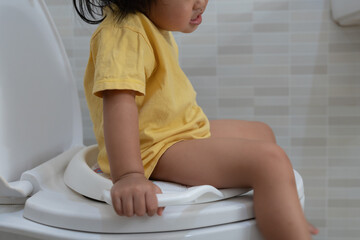 child going to the toilet, constipation in children, dyspepsia, abdominal pain, crying, defecating,...