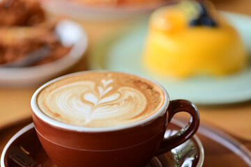high angle view of coffee cup on wood grain table Drinking Concept: Hot Coffee, Latte, Espresso, Cappuccino