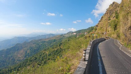 Beautiful road from Kurseong to Darjeeling with layers of mountain in background.