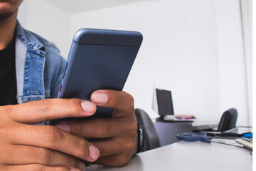 Hand holding smart phone or mobile phone. working office concept. digital payment concept. salaryman. account or financial. purchase or buyer concept. online shopping.