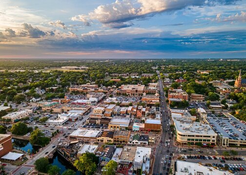 AI generated aerial view of downtown Naperville surrounded by buildings