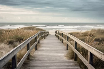 Fotobehang wooden boardwalk to the beach and the ocean, cloudy sky © tl6781