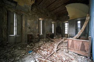 Foto op Plexiglas Oud Ziekenhuis Beelitz Collapsed attic in abandoned building with broken furniture