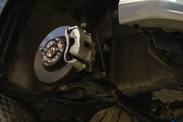 Closeup brake pads of car mechanic repairing. maintenance or checking of car repair concept.