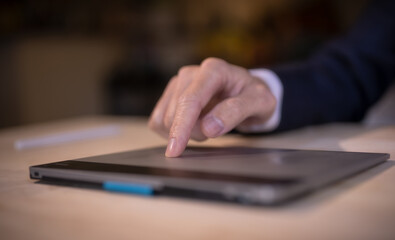 business and technology concept, businessman hand using touch pad working in office
