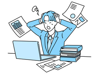 デスクワーク中に頭を抱えて悩む男性・ビジネスマン