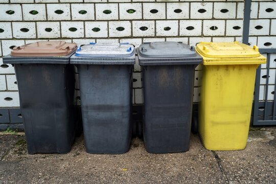  four different garbage bin