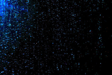Black dark blue white shiny glitter abstract background with space. Twinkling glow stars effect....