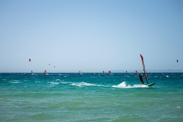 Kitesurfing on Valdevaqueros beach, Gibraltar Strait in Tarifa, Spain on June 17, 2023