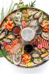 Fresh seafood plate with mussels, oysters, scallop and tuna