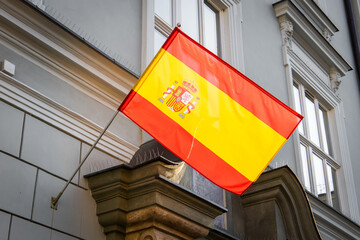 Flag of Spain waving on the face of spanish embassy in Poland
