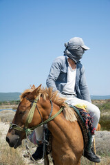 cowboy riding horse