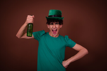 Drag Queen on St. Patrick's Day in a green hat drinks green beer.