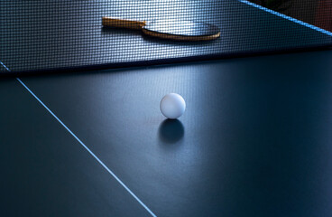 Close-up table tennis ball and racket on the table for the game. - obrazy, fototapety, plakaty