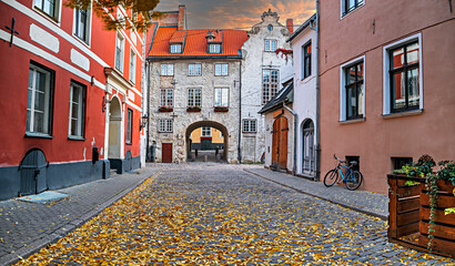 Medieval street in old town of  Riga - the capital and largest city of Latvia, a major commercial,...