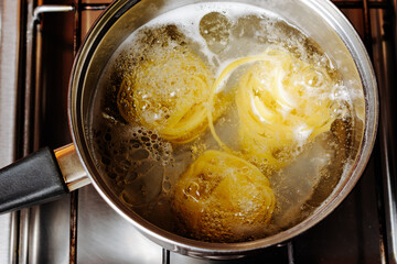 Tagliatelle pasta is cooked in a saucepan.