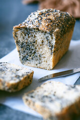 Homemade healthy freshly baked organic whole grain bread with seeds on concrete table. Vegan keto diet. top view. 