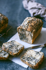 Homemade healthy freshly baked organic whole grain bread with seeds on concrete table. Vegan keto diet. top view