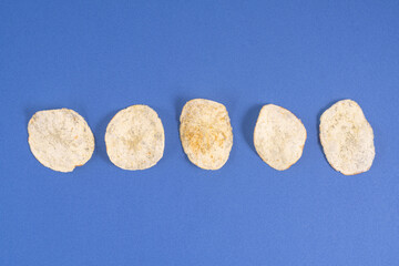 Some chips on a colored surface