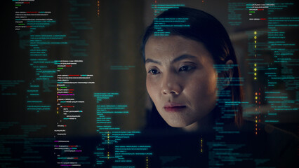 Asian woman working on a computer with binary code protection against cybersecurity threats....