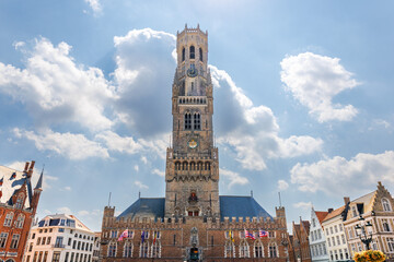 Naklejka premium The Belfry of Bruges, a medieval bell tower in the centre of Bruges, Belgium. One of the city's most prominent symbols, the belfry formerly housed a treasury and the municipal archives