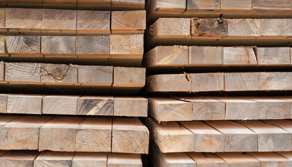 Stack of wooden boards at the lumber mill, closeup of photo