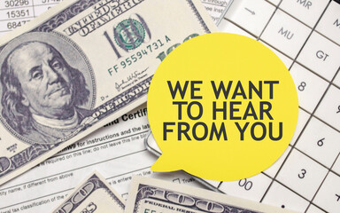 WE WANT TO HEAR FROM YOU words on yellow sticker with dollars and charts