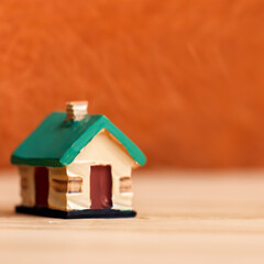 Obraz na płótnie Canvas Minimalist house on orange background