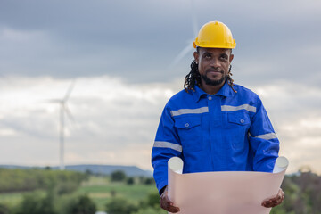 Wind turbine technician checking service. Black African Engineer professional working maintenance clean power generator system