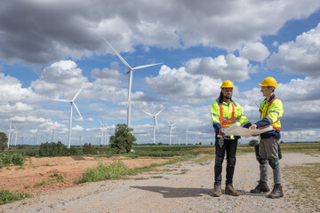 Wind turbine engineer technician male team working service maintenance survey construction site....