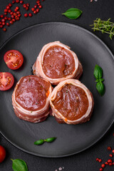 Delicious raw fresh pork or chicken meat rolls wrapped in bacon