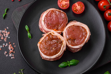 Delicious raw fresh pork or chicken meat rolls wrapped in bacon