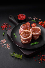 Fototapeta na wymiar Delicious raw fresh pork or chicken meat rolls wrapped in bacon
