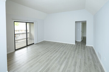 Empty apartment living room with white walls