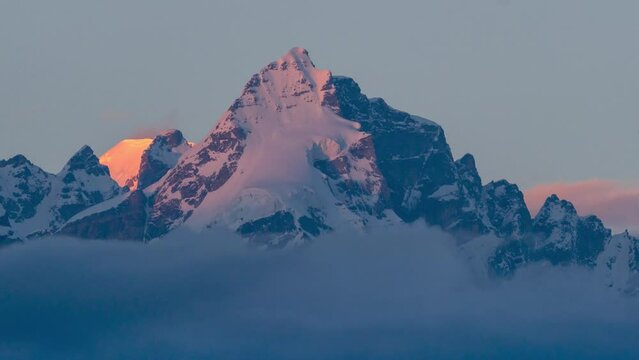 Time lapse of a White Mountain Changing to Golden During Sunset