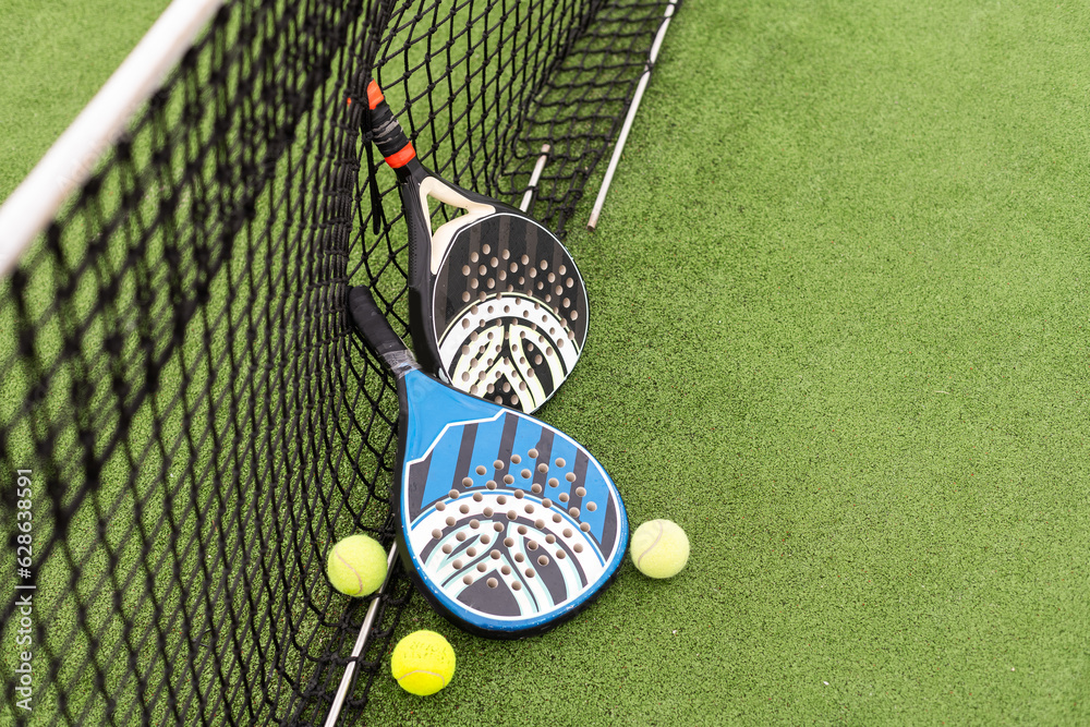 Poster White professional paddle tennis racket with natural lighting on blue background. Horizontal sport theme poster, greeting cards, headers, website and app